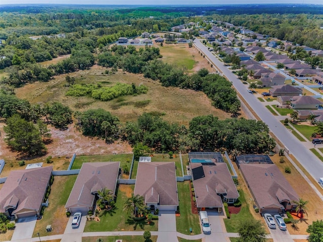 aerial view featuring a view of trees and a residential view
