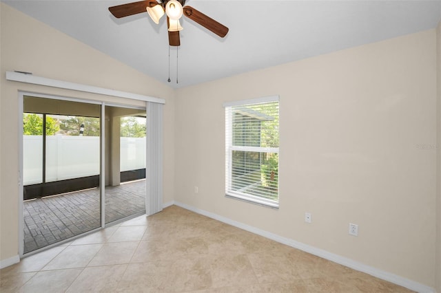 unfurnished bedroom with baseboards, access to outside, multiple windows, and lofted ceiling