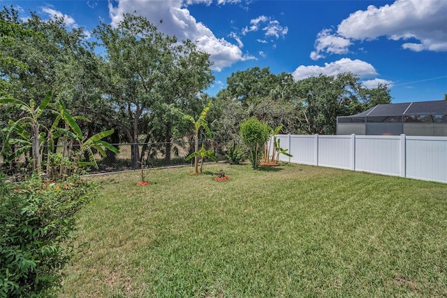 view of yard with a fenced backyard