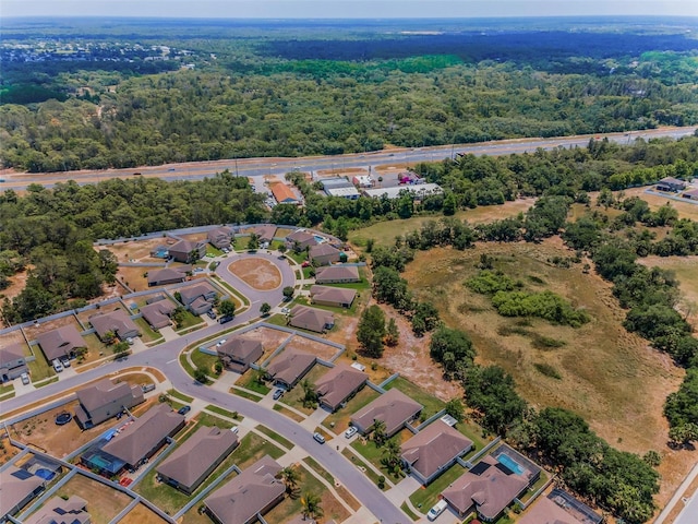 aerial view with a residential view and a wooded view