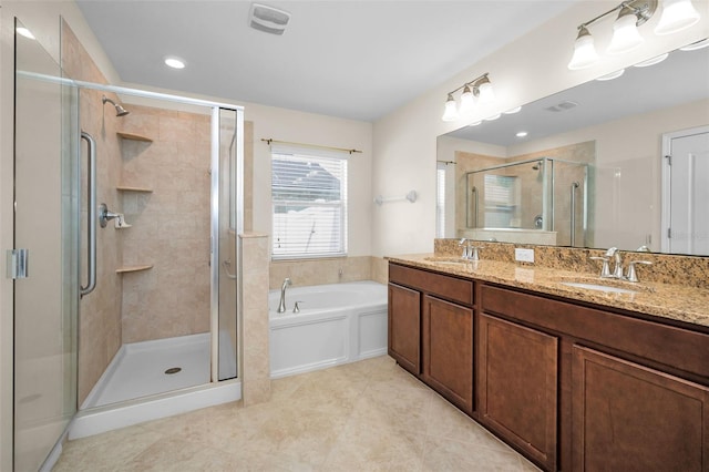 full bathroom with double vanity, a sink, a garden tub, and a stall shower