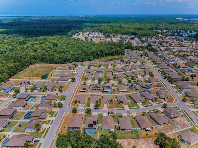 aerial view featuring a residential view and a view of trees