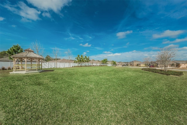 view of yard with a gazebo and fence