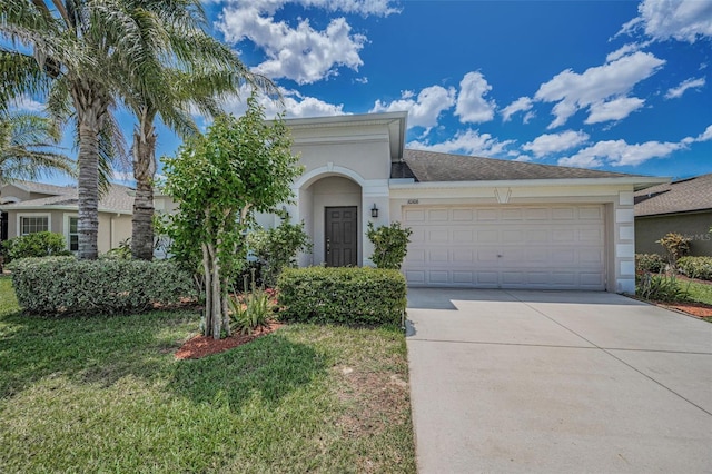 10106 Tolman Dr, Hudson, FL 34667 - view of front of home featuring driveway, a garage, stucco siding, and a front yard