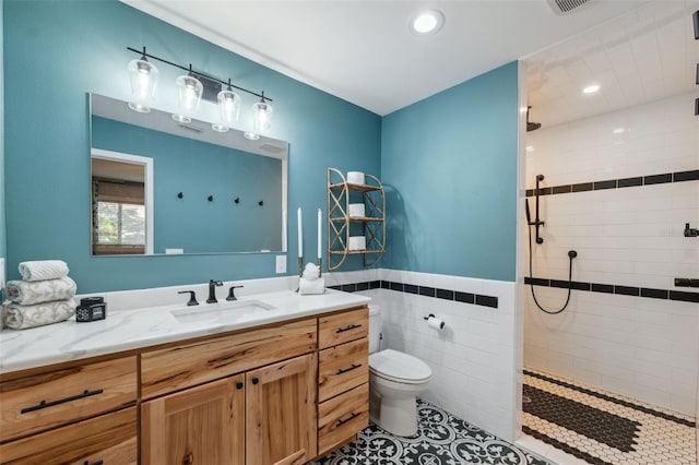 bathroom with vanity, recessed lighting, walk in shower, and toilet