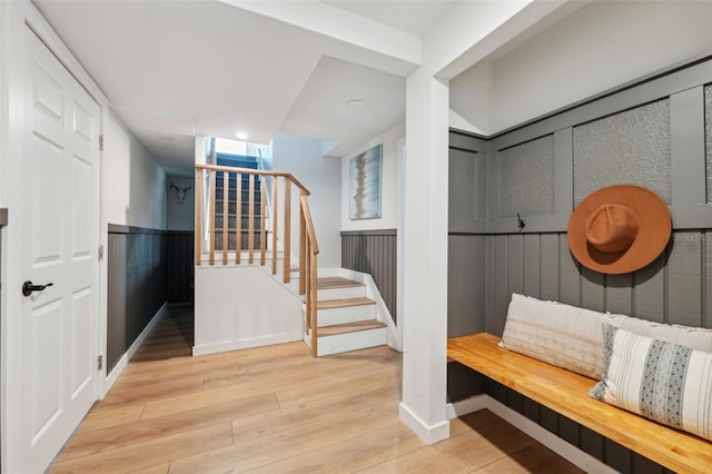 interior space featuring a wainscoted wall and wood finished floors