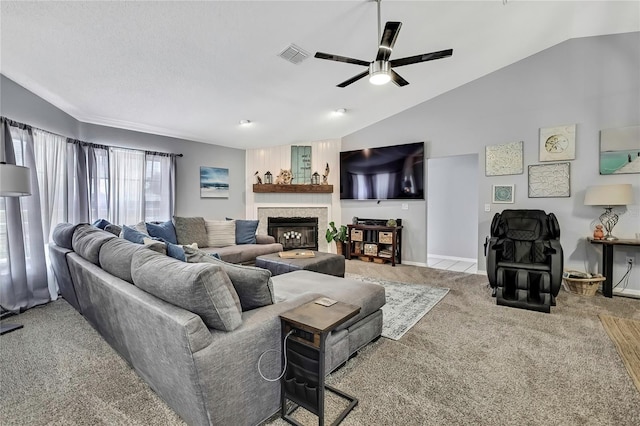 13373 Lawrence St, Spring Hill, FL 34609 - carpeted living room with ceiling fan, a glass covered fireplace, baseboards, vaulted ceiling, and visible vents