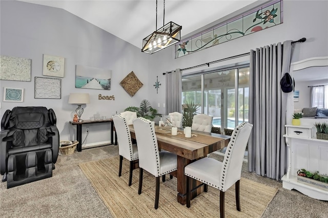 13373 Lawrence St, Spring Hill, FL 34609 - dining area with carpet floors, high vaulted ceiling, and a notable chandelier