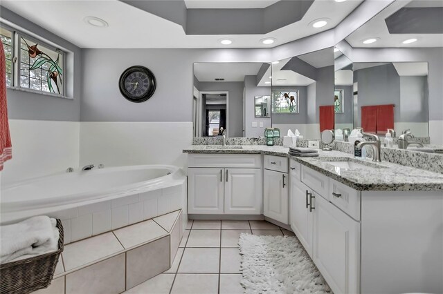 13373 Lawrence St, Spring Hill, FL 34609 - bathroom with recessed lighting, a sink, tile patterned flooring, and a garden tub