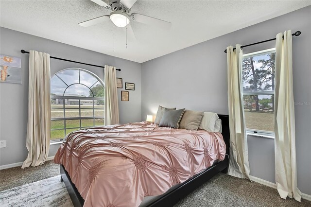13373 Lawrence St, Spring Hill, FL 34609 - carpeted bedroom featuring baseboards, multiple windows, and ceiling fan