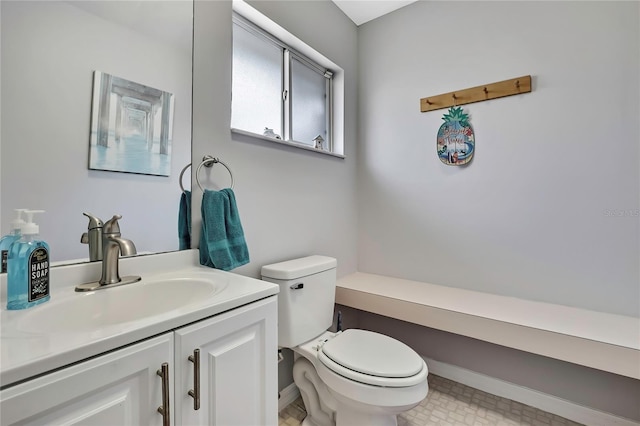 13373 Lawrence St, Spring Hill, FL 34609 - half bath featuring vanity, baseboards, and toilet