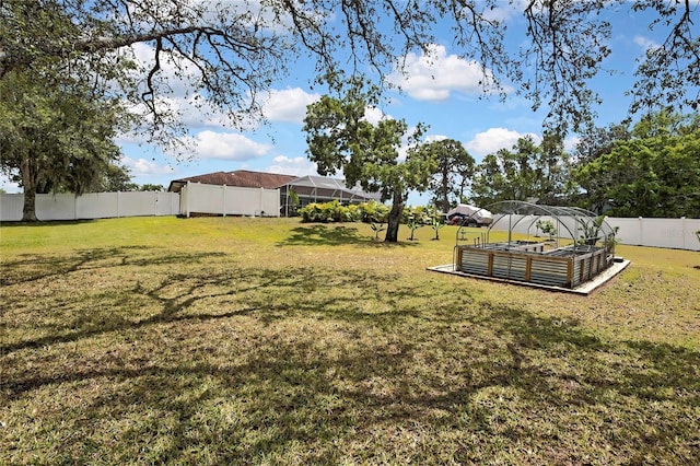 13373 Lawrence St, Spring Hill, FL 34609 - view of yard with a fenced backyard and a vegetable garden