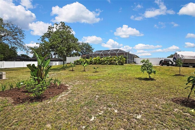 13373 Lawrence St, Spring Hill, FL 34609 - view of yard with glass enclosure and fence