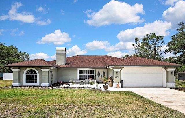 13373 Lawrence St, Spring Hill, FL 34609 - view of front of house featuring a chimney, a front yard, a garage, concrete driveway, and stucco siding