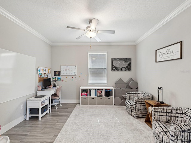 8630 Campus Woods Way, New Port Richey, FL 34655 - sitting room featuring crown molding, baseboards, ceiling fan, and a textured ceiling