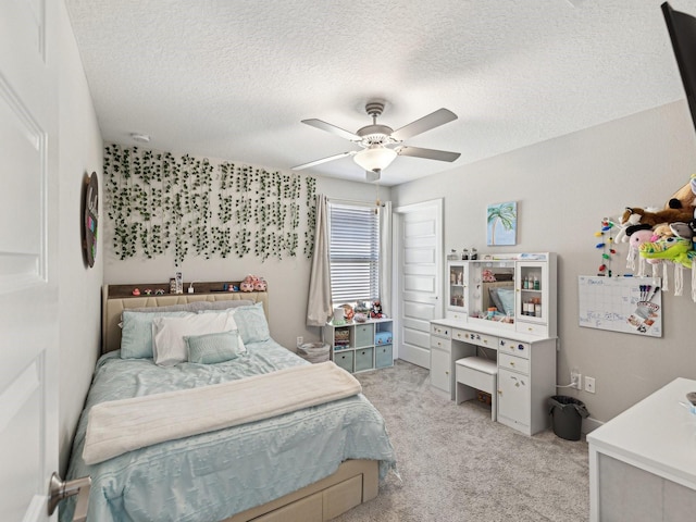 8630 Campus Woods Way, New Port Richey, FL 34655 - bedroom featuring light colored carpet, a textured ceiling, and ceiling fan