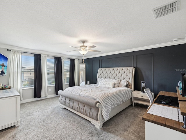 8630 Campus Woods Way, New Port Richey, FL 34655 - carpeted bedroom with a ceiling fan, a textured ceiling, visible vents, baseboards, and ornamental molding