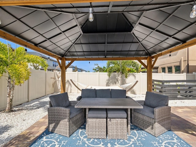 8630 Campus Woods Way, New Port Richey, FL 34655 - view of patio with a fenced backyard, an outdoor hangout area, and a gazebo
