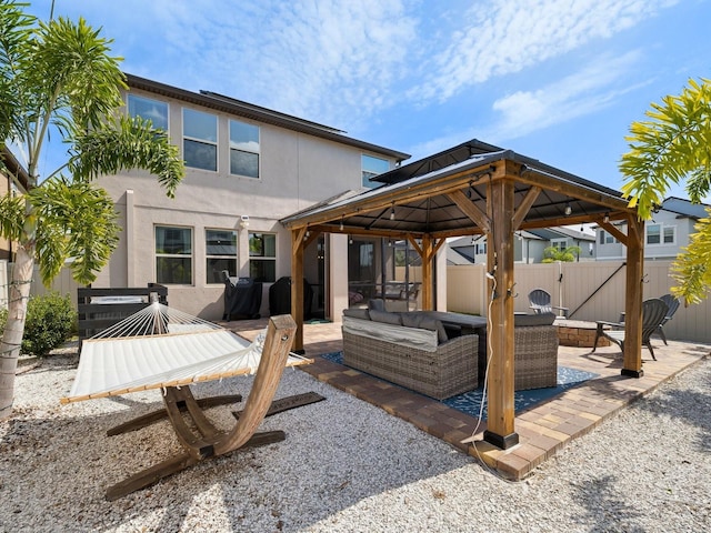 8630 Campus Woods Way, New Port Richey, FL 34655 - view of patio featuring fence, a gazebo, and outdoor lounge area