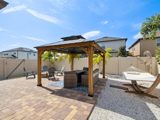 8630 Campus Woods Way, New Port Richey, FL 34655 - view of patio featuring a gazebo, a fenced backyard, and an outdoor hangout area
