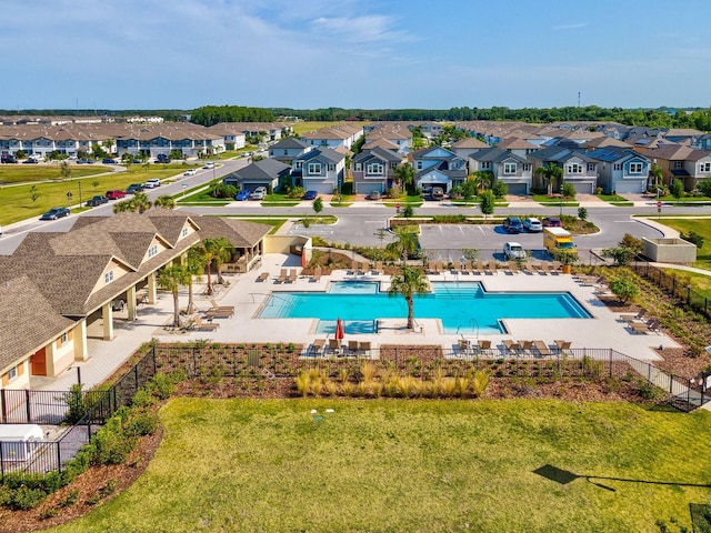 8630 Campus Woods Way, New Port Richey, FL 34655 - community pool featuring a residential view and fence