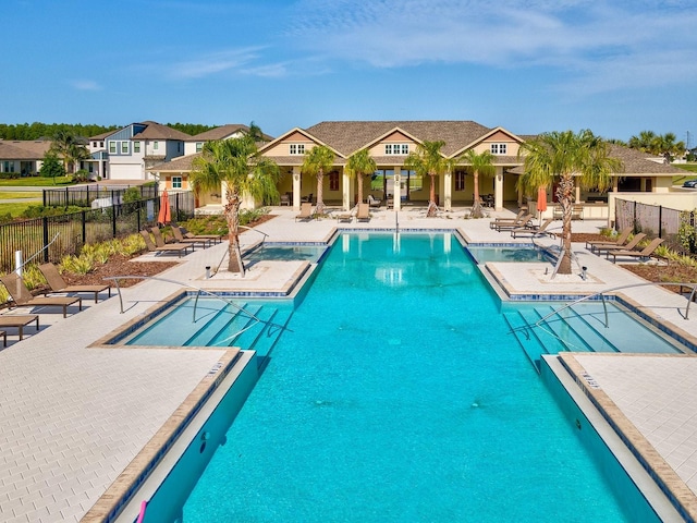 8630 Campus Woods Way, New Port Richey, FL 34655 - pool with a patio, fence, and a residential view