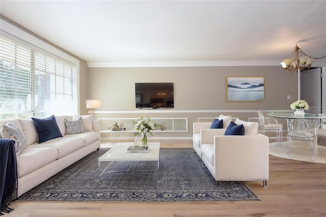 12210 Quail Run Row, Hudson, FL 34667 - living area with an inviting chandelier, ornamental molding, and wood finished floors