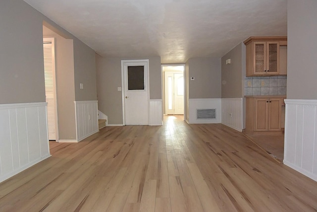 12210 Quail Run Row, Hudson, FL 34667 - bonus room with wainscoting, light wood finished floors, and visible vents