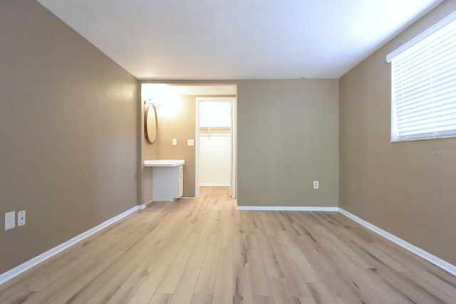 12210 Quail Run Row, Hudson, FL 34667 - spare room with baseboards and light wood-style flooring
