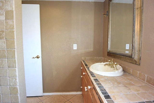 12210 Quail Run Row, Hudson, FL 34667 - bathroom with vanity, tile patterned flooring, and baseboards