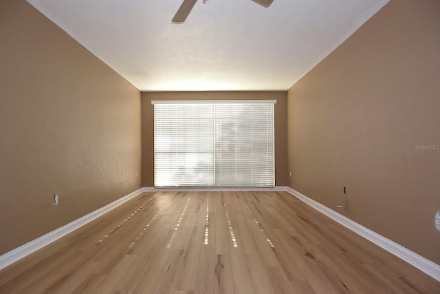 12210 Quail Run Row, Hudson, FL 34667 - spare room with a ceiling fan, baseboards, and light wood finished floors