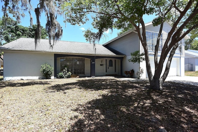 12210 Quail Run Row, Hudson, FL 34667 - view of front of home with stucco siding