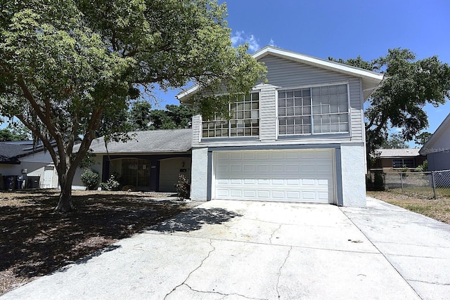 12210 Quail Run Row, Hudson, FL 34667 - traditional-style home with concrete driveway, an attached garage, and fence
