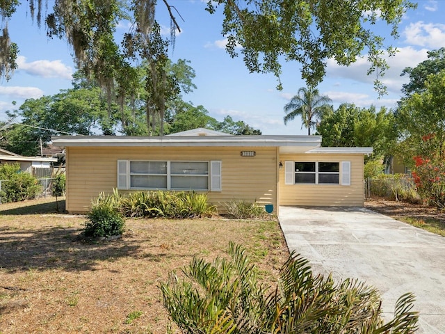 bungalow with fence and driveway