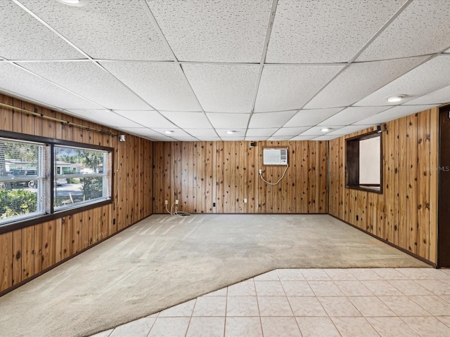 interior space featuring light colored carpet, a wall mounted AC, and wooden walls