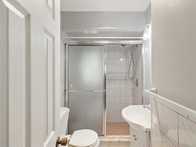 full bathroom with vanity, a stall shower, and toilet