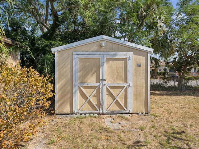 view of shed with fence