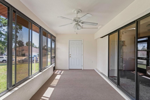 7270 Nightwalker Rd, Weeki Wachee, FL 34613 - unfurnished sunroom featuring carpet floors and a wealth of natural light
