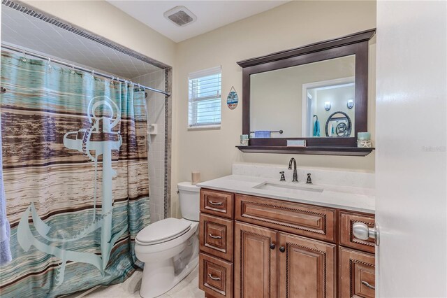 bathroom with toilet, visible vents, curtained shower, and vanity