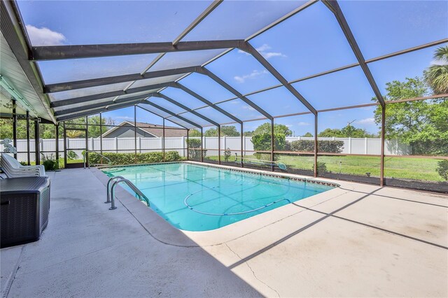 view of pool with a fenced in pool, a lanai, a fenced backyard, and a patio area