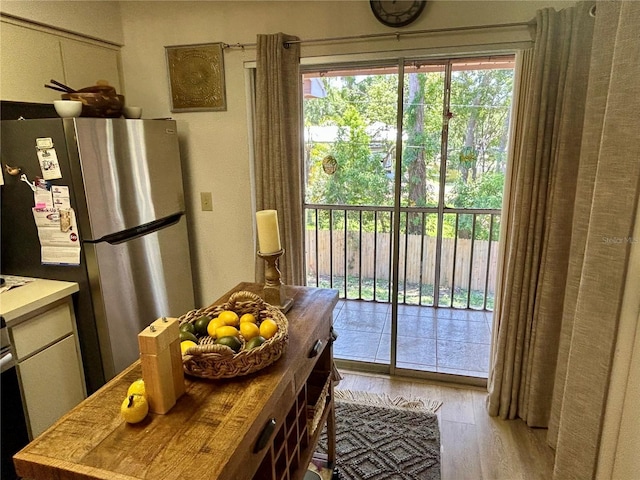 dining room with a wealth of natural light and wood finished floors