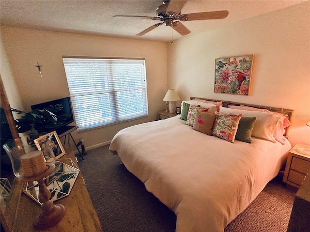 carpeted bedroom featuring baseboards and ceiling fan