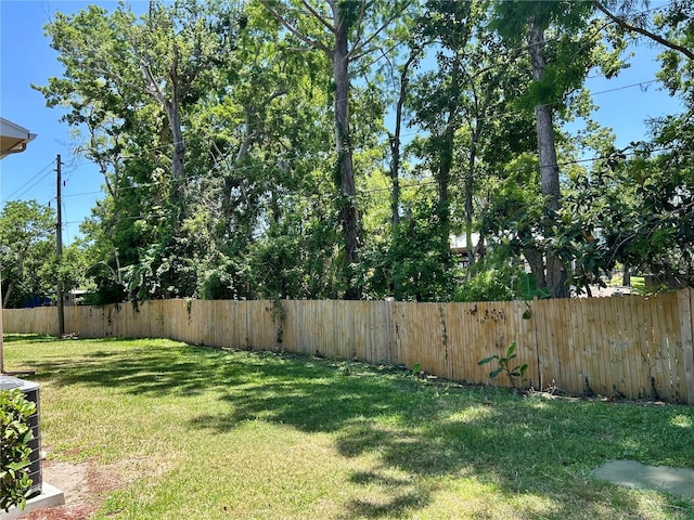 view of yard with a fenced backyard