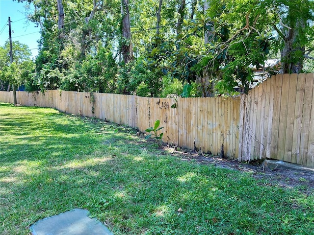 view of yard with a fenced backyard