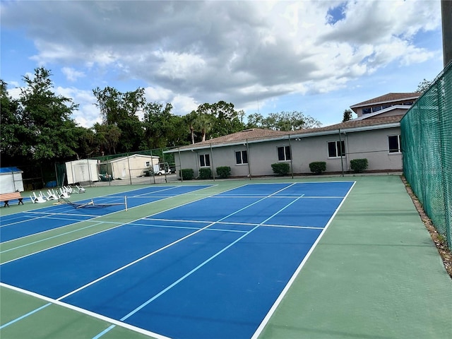 view of sport court with fence