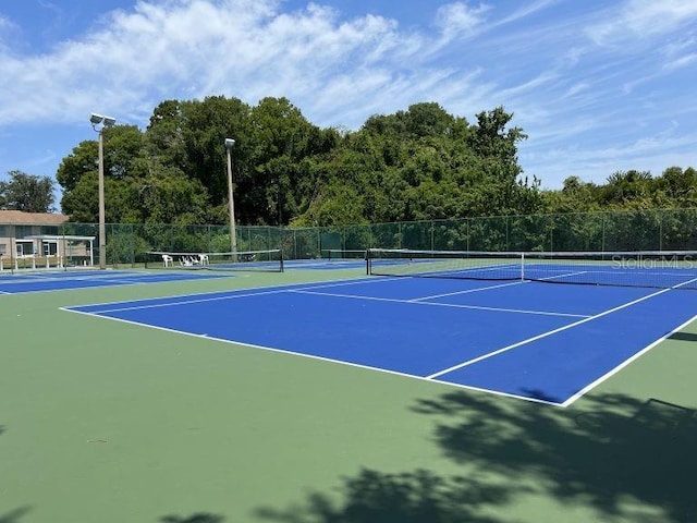 view of sport court featuring fence and community basketball court