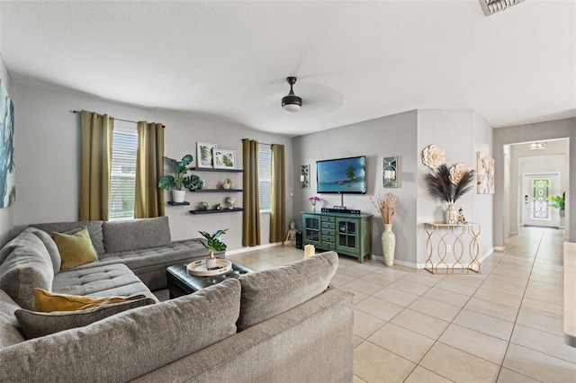 21167 Pleasant Plains Pkwy, Land O Lakes, FL 34637 - living area with baseboards, ceiling fan, light tile patterned flooring, and visible vents