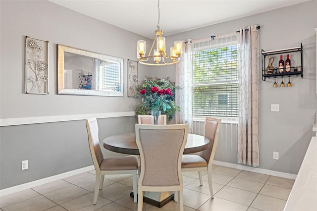 21167 Pleasant Plains Pkwy, Land O Lakes, FL 34637 - dining space featuring baseboards, a chandelier, and tile patterned floors