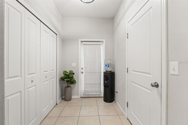 21167 Pleasant Plains Pkwy, Land O Lakes, FL 34637 - hallway featuring light tile patterned flooring and baseboards