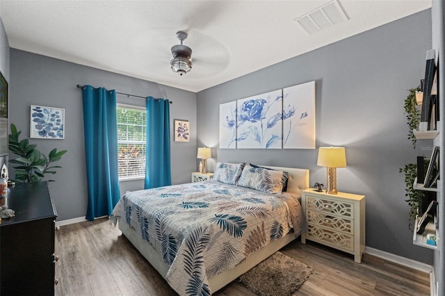 21167 Pleasant Plains Pkwy, Land O Lakes, FL 34637 - bedroom with visible vents, a ceiling fan, baseboards, and wood finished floors